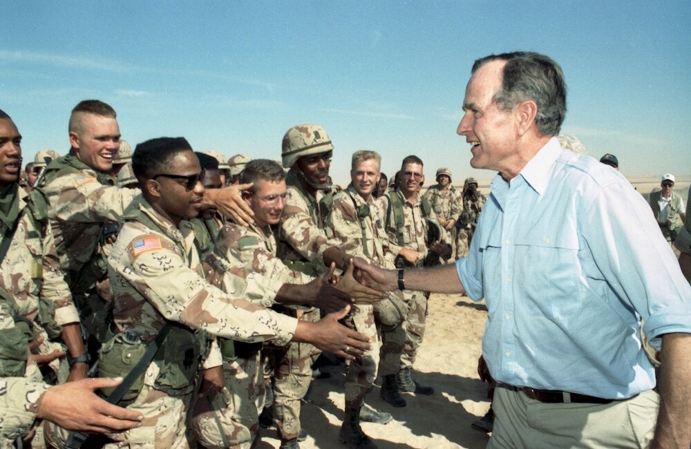 In an undated photo from his presidential library, President George H.W. Bush greets American troops in Saudi Arabia weeks before the start of the Persian Gulf war in 1991. . Bush, the 41st president of the United States and the father of the 43rd, who steered the nation through a tumultuous period in world affairs but was denied a second term after support for his presidency collapsed under the weight of an economic downturn, died on Nov. 30, 2018. He was 94. (George Bush Presidential Library via The New York Times) -- NO SALES; FOR EDITORIAL USE ONLY WITH NYT STORY FIRST OBIT-BUSH BY NAGOURNEY FOR DEC. 1, 2018. ALL OTHER USE PROHIBITED. --
