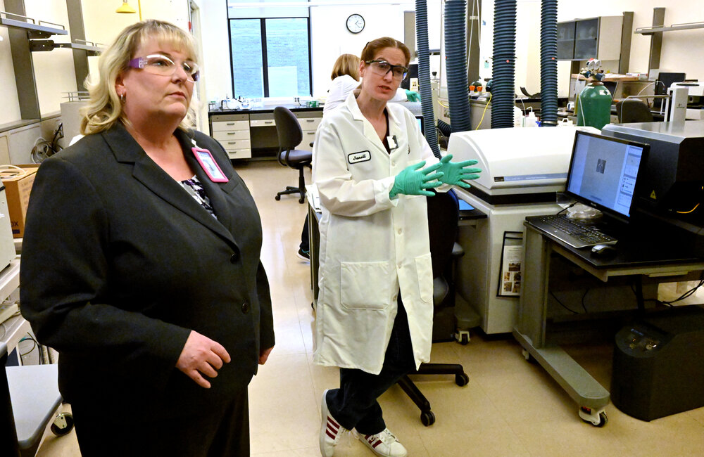 MARC SCHULTZ/GAZETTE PHOTOGRAPHER
At right, GE Global Research, Analytical Chemist, Janell Crowder, talks about material performance, by testing materials for certain elements in the characterization labs at GE Global Research. Chief Scientist Amy Linsebigler is seen at left.