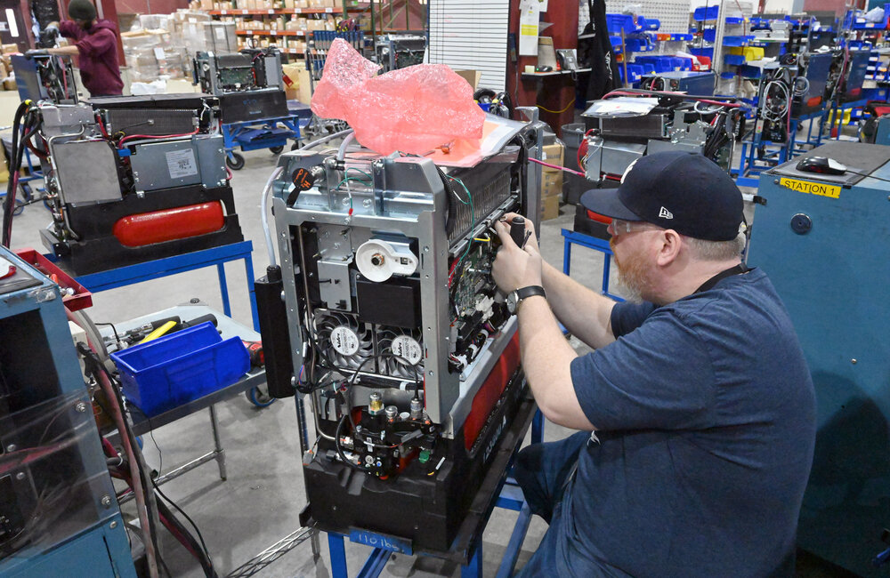 MARC SCHULTZ/GAZETTE PHOTOGRAPHER
Senior Technician, John Cain works on a Plug Power aircooled 4K GenDrive system in the production facility in Latham.
