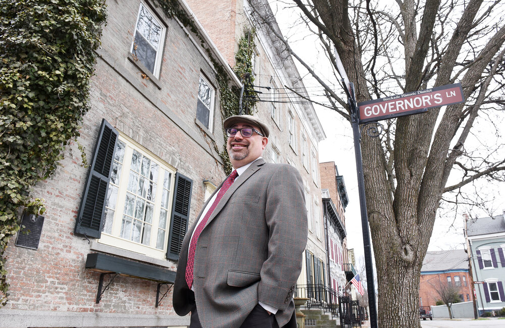 ERICA MILLER/GAZETTE PHOTOGRAPHER  
City of Schenectady City Historian Chris Leonard stands in front of Yates Mansion in the Stockades which is up for sale again, in Schenectady on Thursday, April 11, 2019.