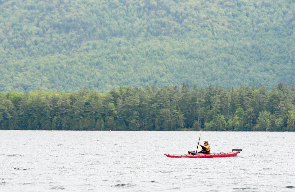 ERICA MILLER/GAZETTE PHOTOGRAPHER  
Alyson Mullarney, of Lake George, kayaks near the Lake George Suites in Lake George on Thursday, May 30, 2019.