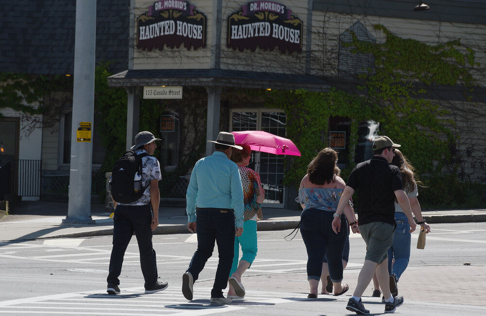 ERICA MILLER/GAZETTE PHOTOGRAPHER  
People enjoy the nice weather on Canada Street in the Village of Lake George in Lake George on Sunday, June 9, 2019.