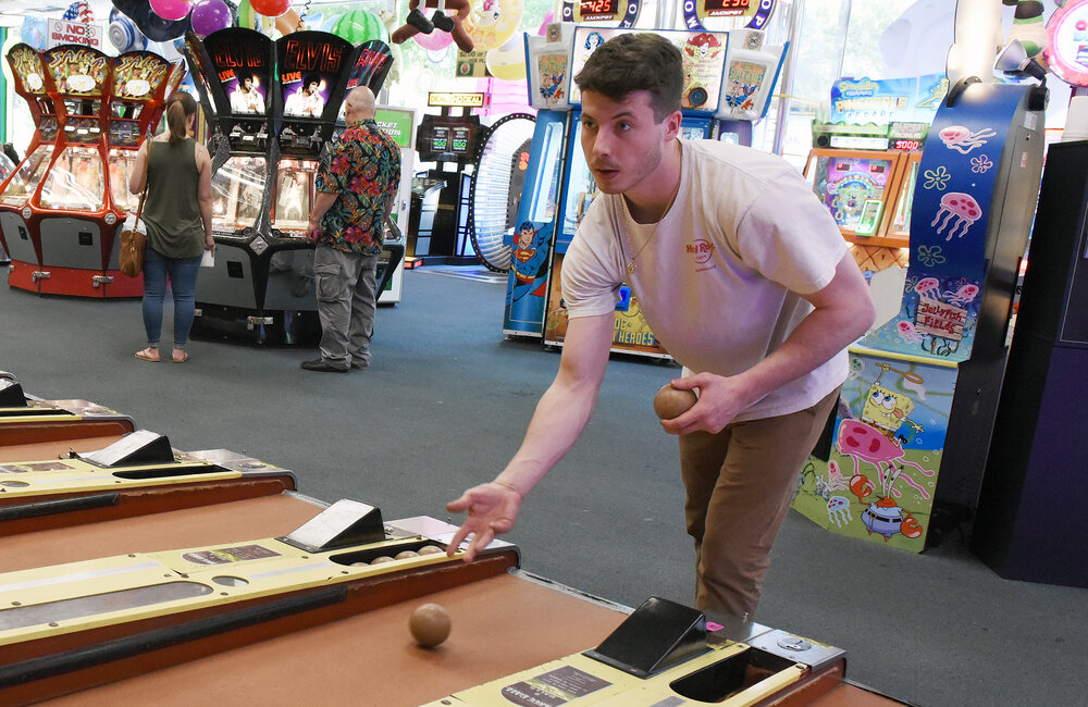 ERICA MILLER/GAZETTE PHOTOGRAPHER  
Will Janos, of Queensbury, plays a game of skeeball at Playland Arcade on Canada Street in the Village of Lake George in Lake George on Sunday, June 9, 2019.